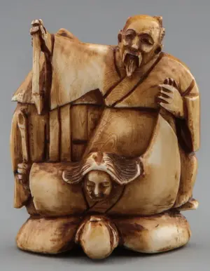 JAPANESE CARVED IVORY NETSUKE OF BALANCING MEN