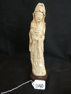 IVORY MAN HOLDING CHILD - ROUND WOOD STAND -