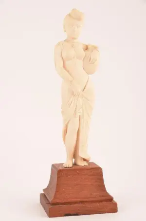 Finely carved elephant ivory figure of a lady on a wood