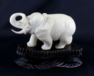Carved Ivory Elephant on Wooden Stand