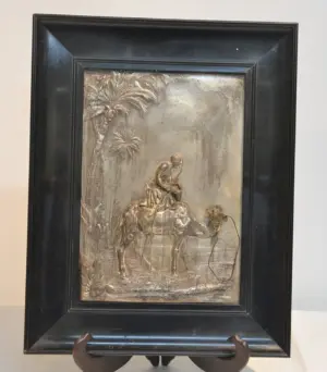 ORIENTALIST SILVERED PLAQUE OF MAN ON CAMEL