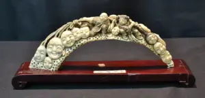 CARVED HIPPO IVORY BRIDGE DEPICTING CHILDREN