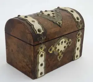A 19thC walnut semi domed caddy with ivory and brass