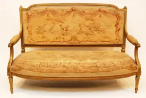 AN ANTIQUE LOUIS XV STYLE GILTWOOD SETTEE