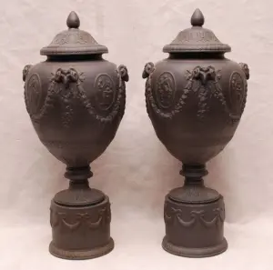 Pair of Waterford black basalt urns with separate