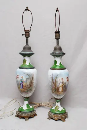 Pair of Sevres urn form lamps, angel and maiden mo