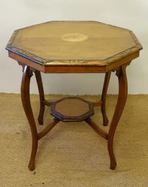 A Victorian carved and inlaid 2-tier octagonal