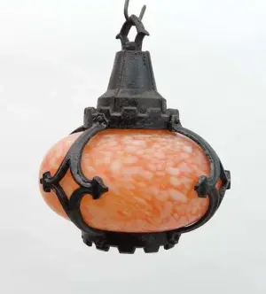 An early 20thC marbelled glass and painted cast iron