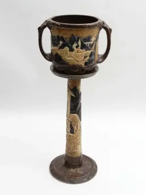 A Bretby 2-handled jardinière on a tall stand