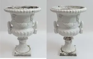 A pair of c.1900 cast iron painted urns with loop