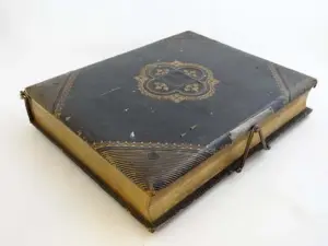 A Victorian gold tooled black leather photograph album