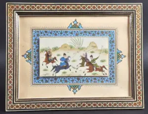 A PERSIAN IVORY FRAMED PLAQUE, Playing Polo