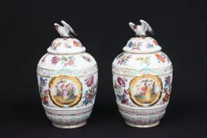 Pair Dresden covered urns with bird finials